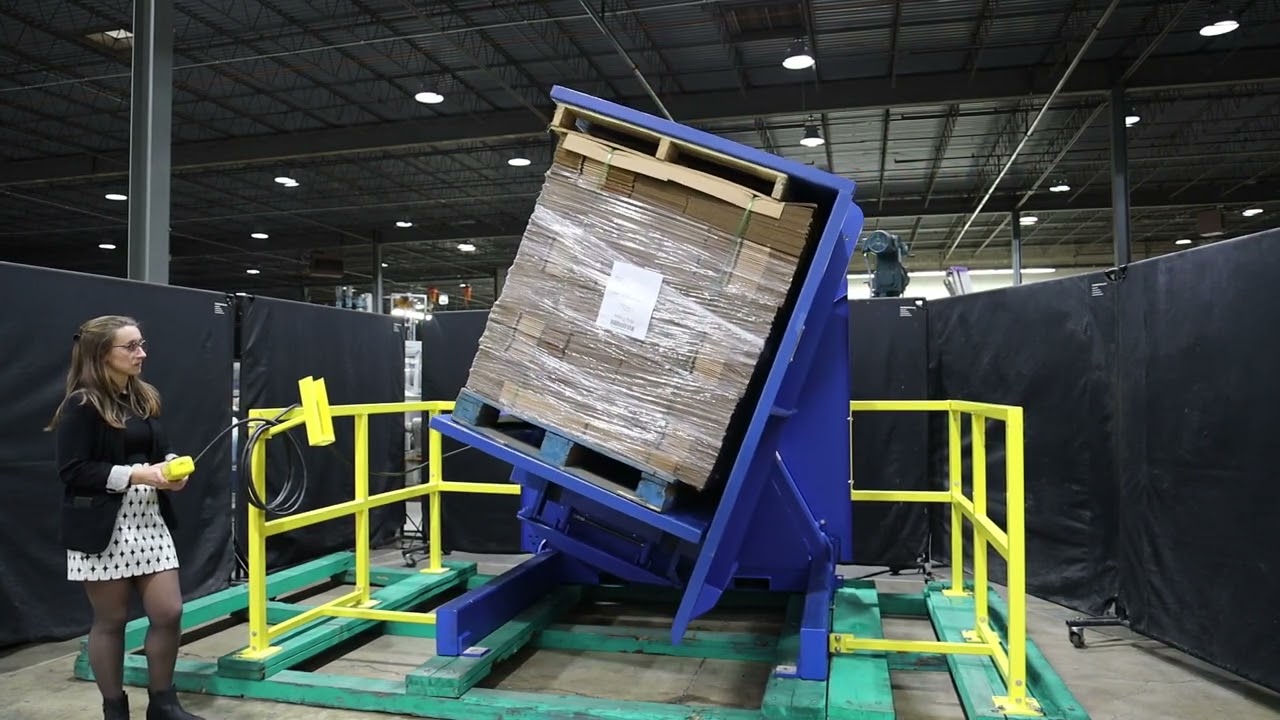 alt with keywords: A modern pallet inverter with integrated light curtains and safety signals.