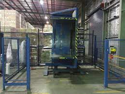 A pallet changer for manufacturing showing safety features like guarding.