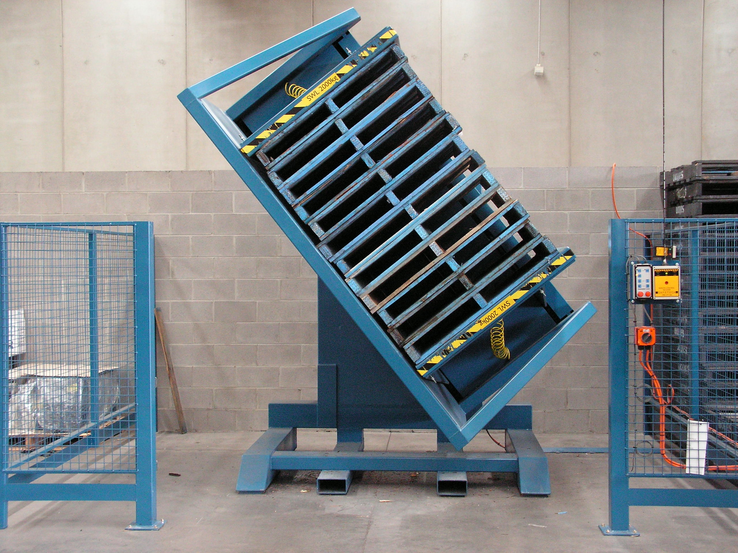 A compact pallet changer machine designed for space-saving in a warehouse