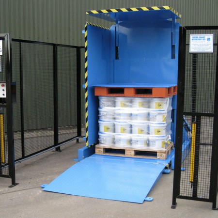 alt with keywords: A heavy-duty pallet changer designed for industrial loads like steel coils or heavy machinery