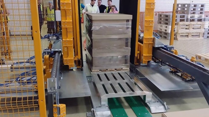 alt with keywords: A pallet changer machine integrated into a lean manufacturing line, showcasing operational cost reduction.