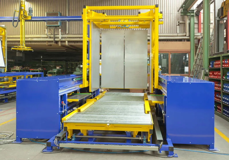 An operator receiving training on how to use a pallet inverter safely and efficiently