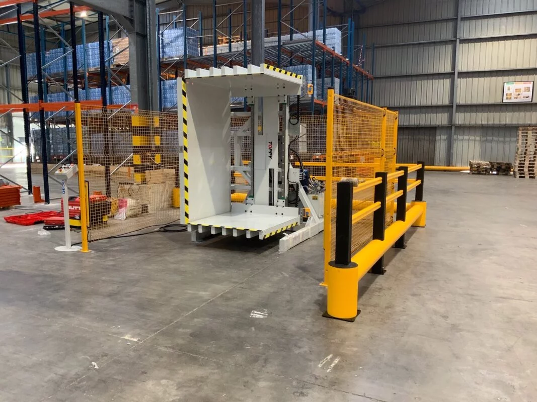 A pallet inverter in a workshop, indicating maintenance and troubleshooting aspects.