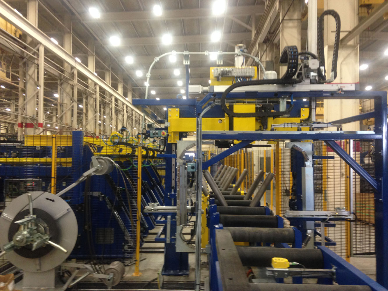 Coil strapping equipment