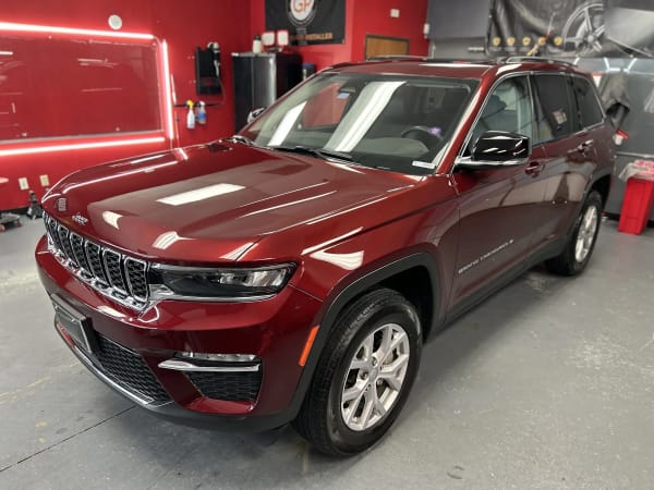 Red Jeep Grand Cherokee paint correction in shop