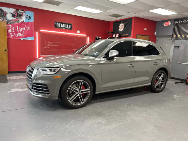 Silver Audi Q7 detailing in Prismatic Car Care shop