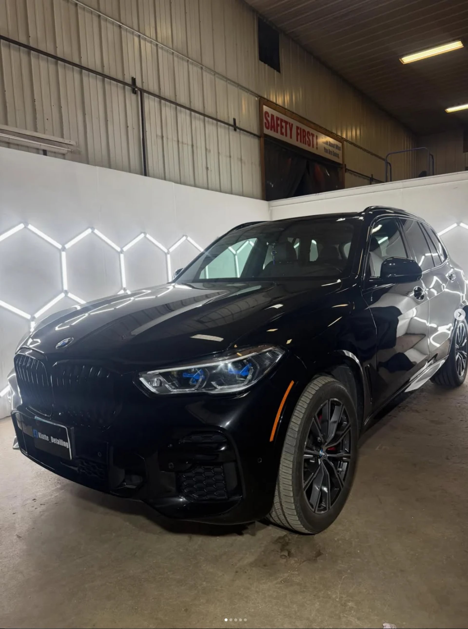 Black BMW X5 with a glossy, reflective finish