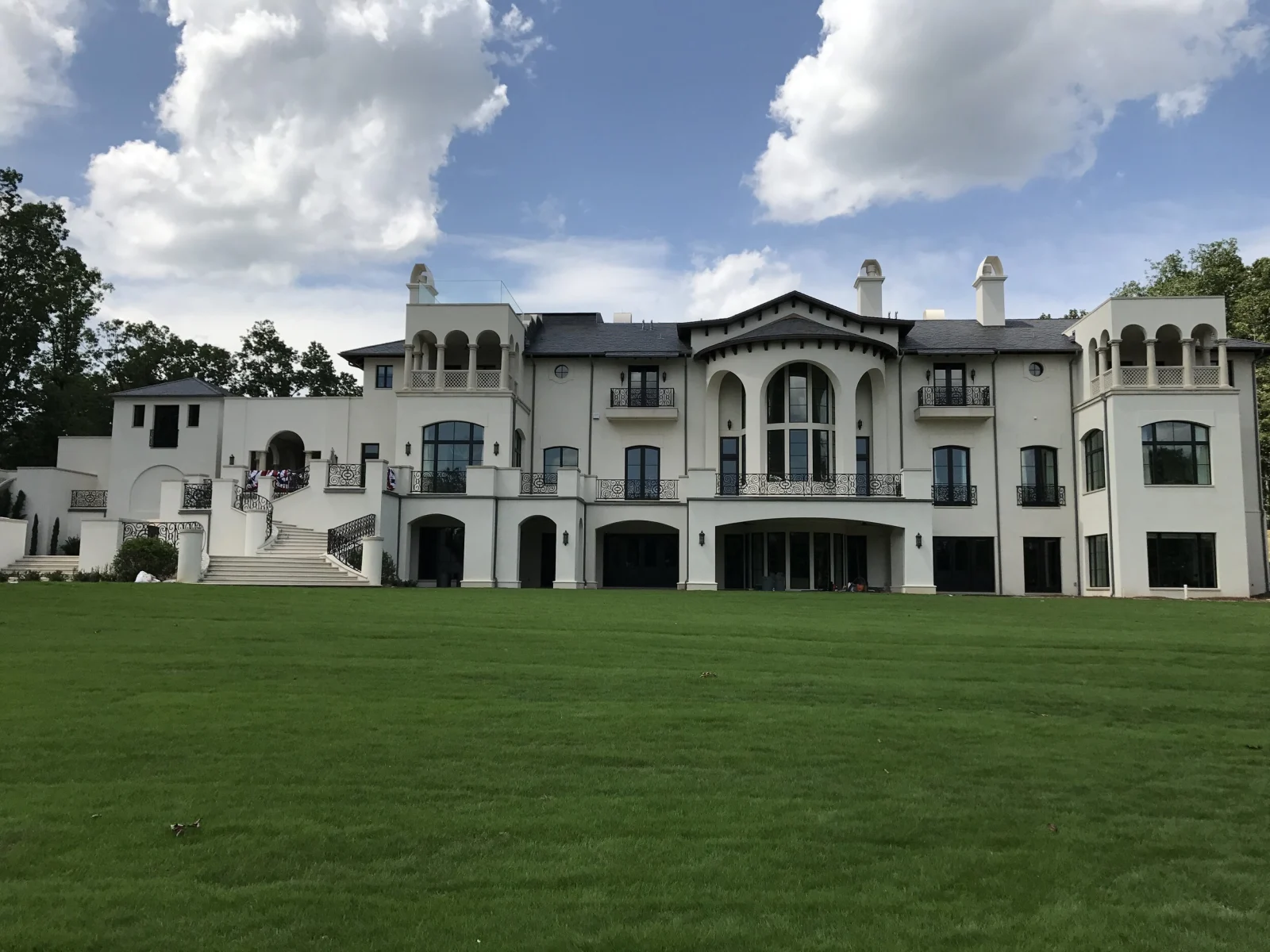 Expansive estate lawn and residence
