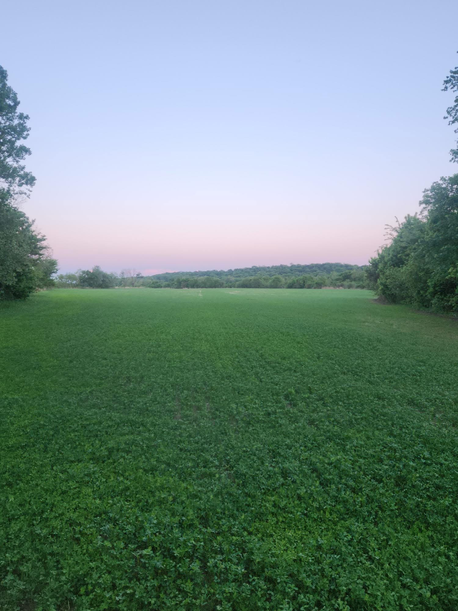 Invitation or visit us graphic, or a scenic closing photo of the farm at sunset