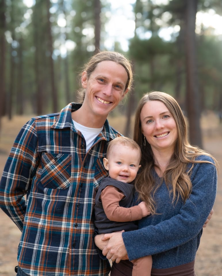 Mom, dad, and child in golden light during a family photography session in Bend, Oregon