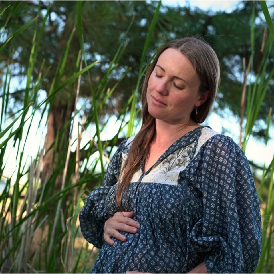 Amara in a blue dress during her Wild Play Photography maternity session