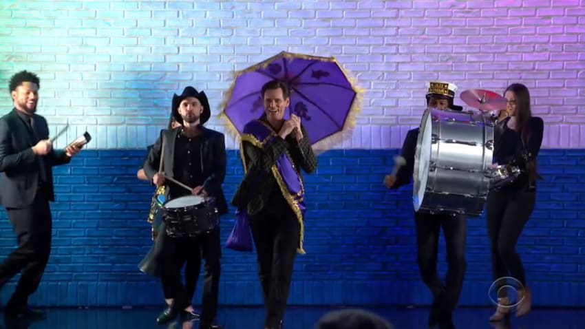 Watch Jim Carrey Make ‘Colbert’ Entrance With Jon Batiste & Stay Human Second Line