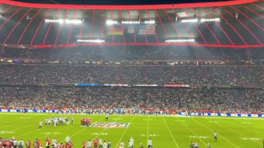 Watch 70K Fans Sing ‘Take Me Home, Country Roads’ At NFL Game In Munich