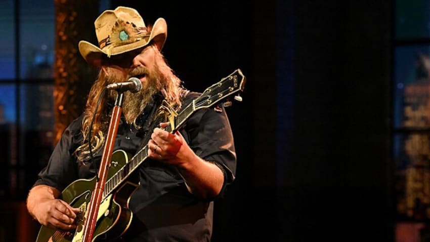 Watch Chris Stapleton Perform Willie Nelson’s ‘Living In The Promiseland’ On ‘Colbert’