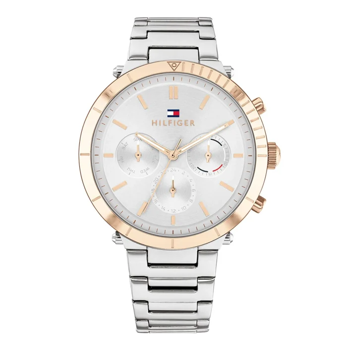 A stylish Tommy Hilfiger watch featuring a silver dial, rose gold accents, and a silver metal bracelet.