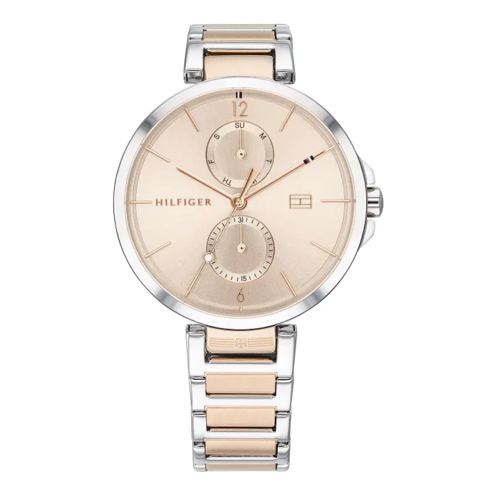 Sleek Tommy Hilfiger watch with a gold-toned dial, dual sub-dials, and a silver and rose gold metal bracelet. Elegant timepiece design.