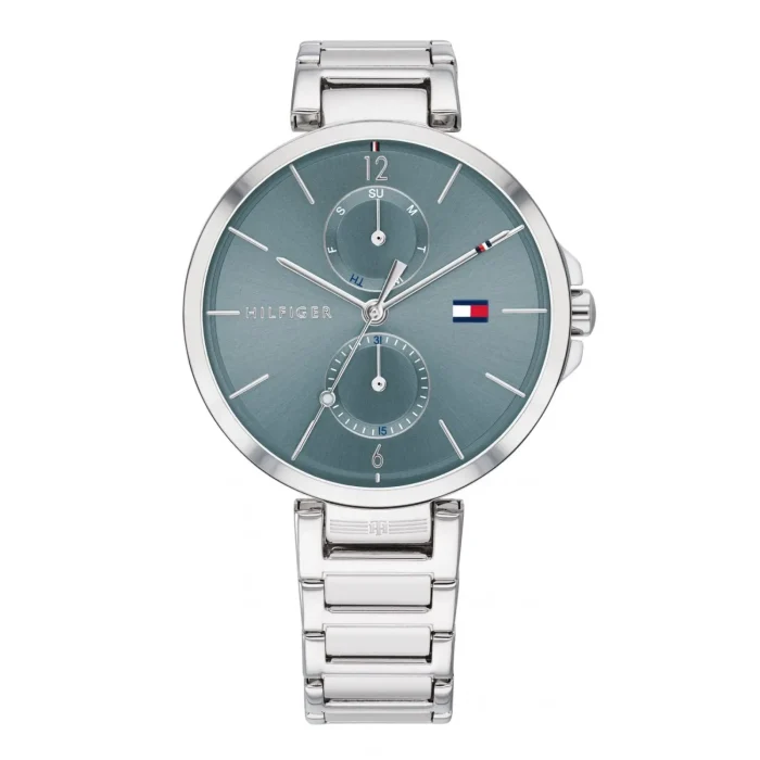 A sleek silver Tommy Hilfiger watch with a blue dial, featuring date and day indicators, and a modern bracelet design.