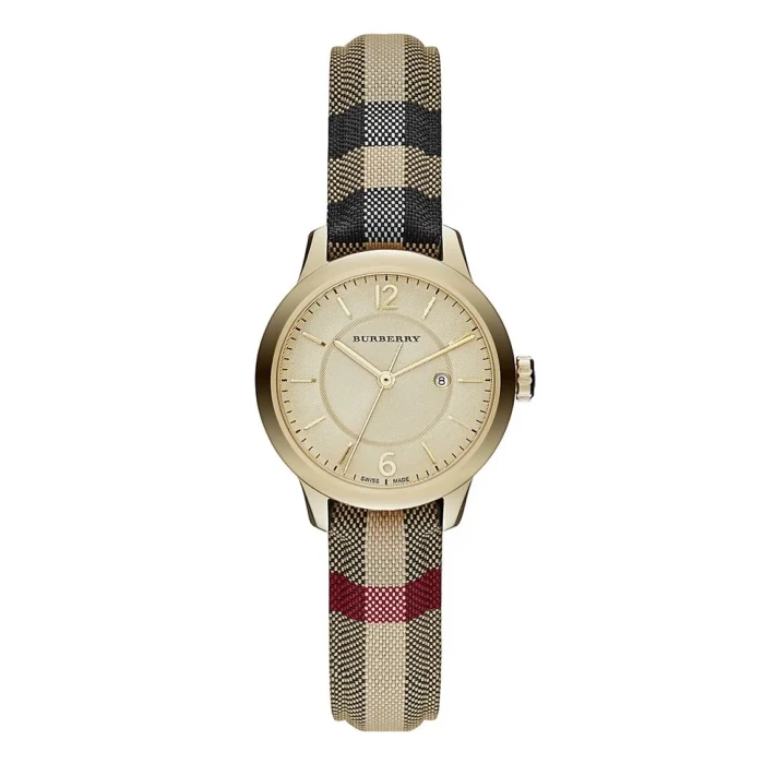 BU10104 A gold Burberry watch with a minimalist dial and date feature, featuring a plaid fabric strap in beige, black, and red.