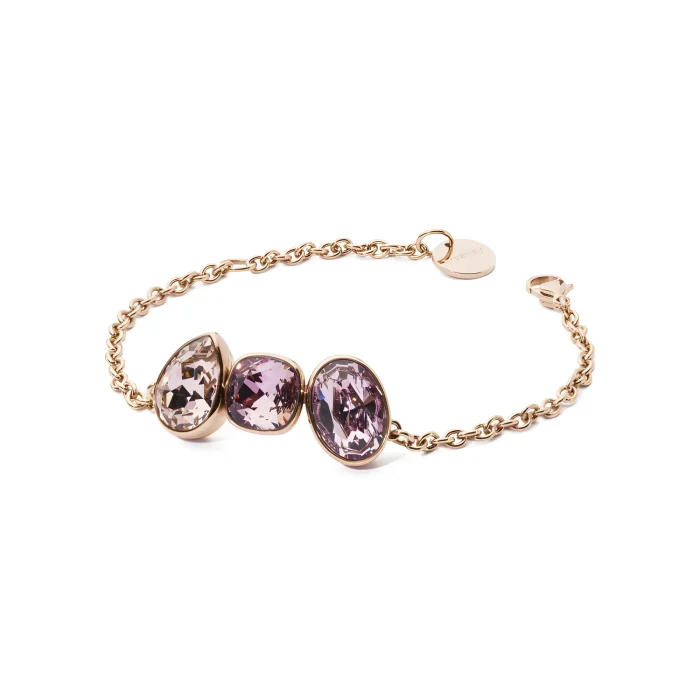 BFN18 A delicate gold chain bracelet featuring three oval, purple gemstones, elegantly showcasing their sparkling facets.