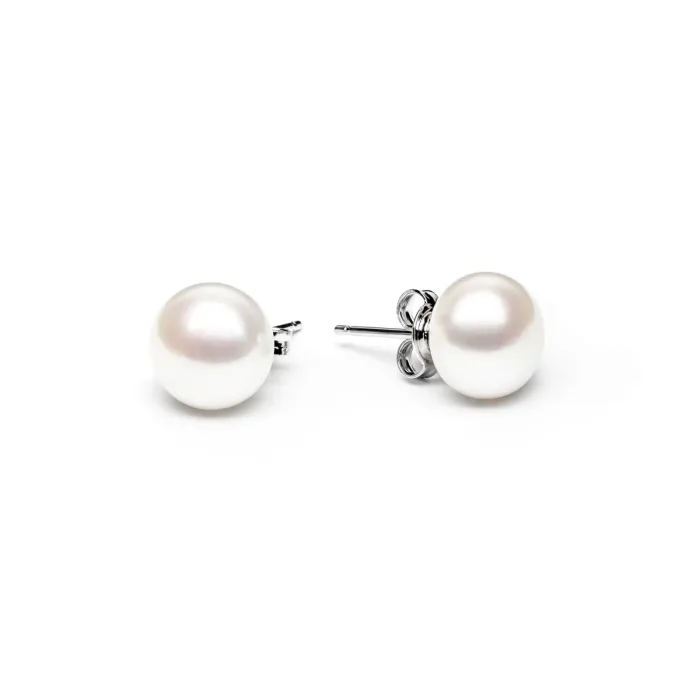 Elegant white pearl stud earrings with silver posts, showcasing a classic and timeless design against a simple white background