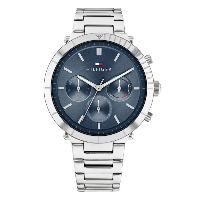 TOMMY HILFIGER 1782349 Hõbedane roostevabast terasest kronograafkell sinise numbrilauaga, kolme alamskaalaga ja Hilfigeri logoga ülaosas.