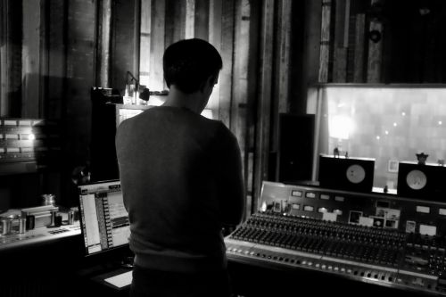 Image of Beau (the engineer) intensely listening to mixes