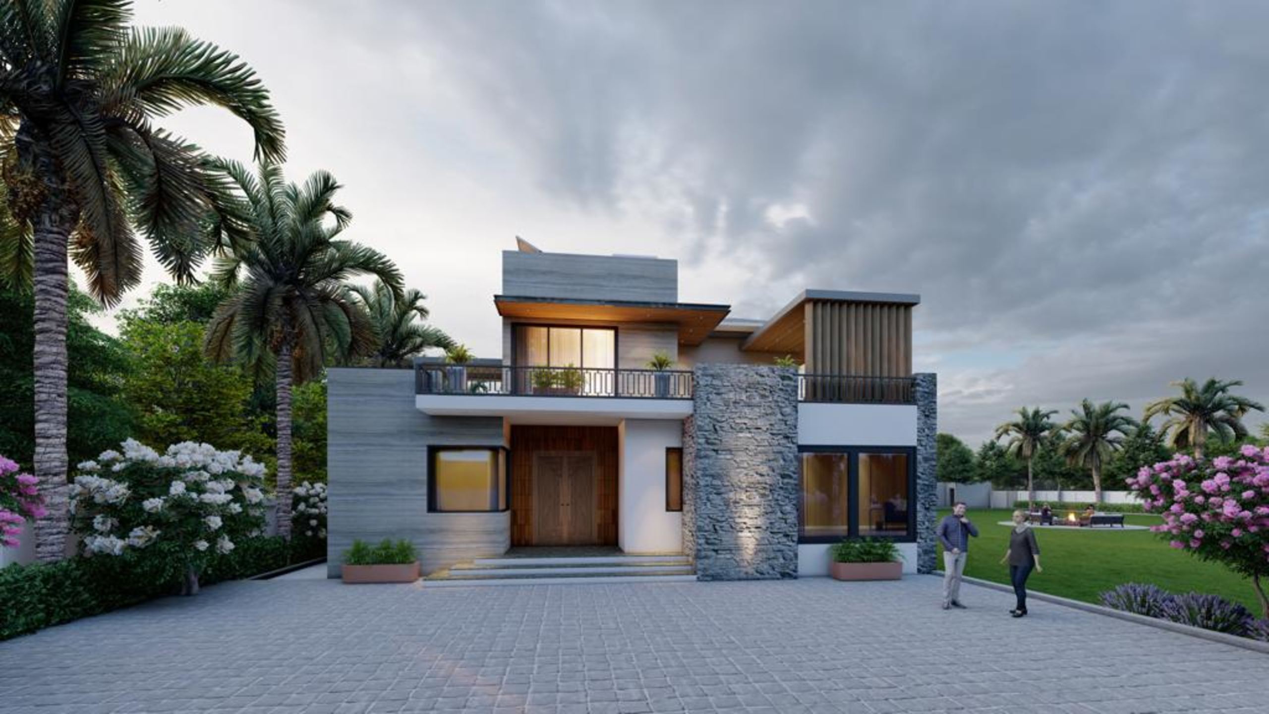 Stone-clad farmhouse entrance with timber doors and paved forecourt