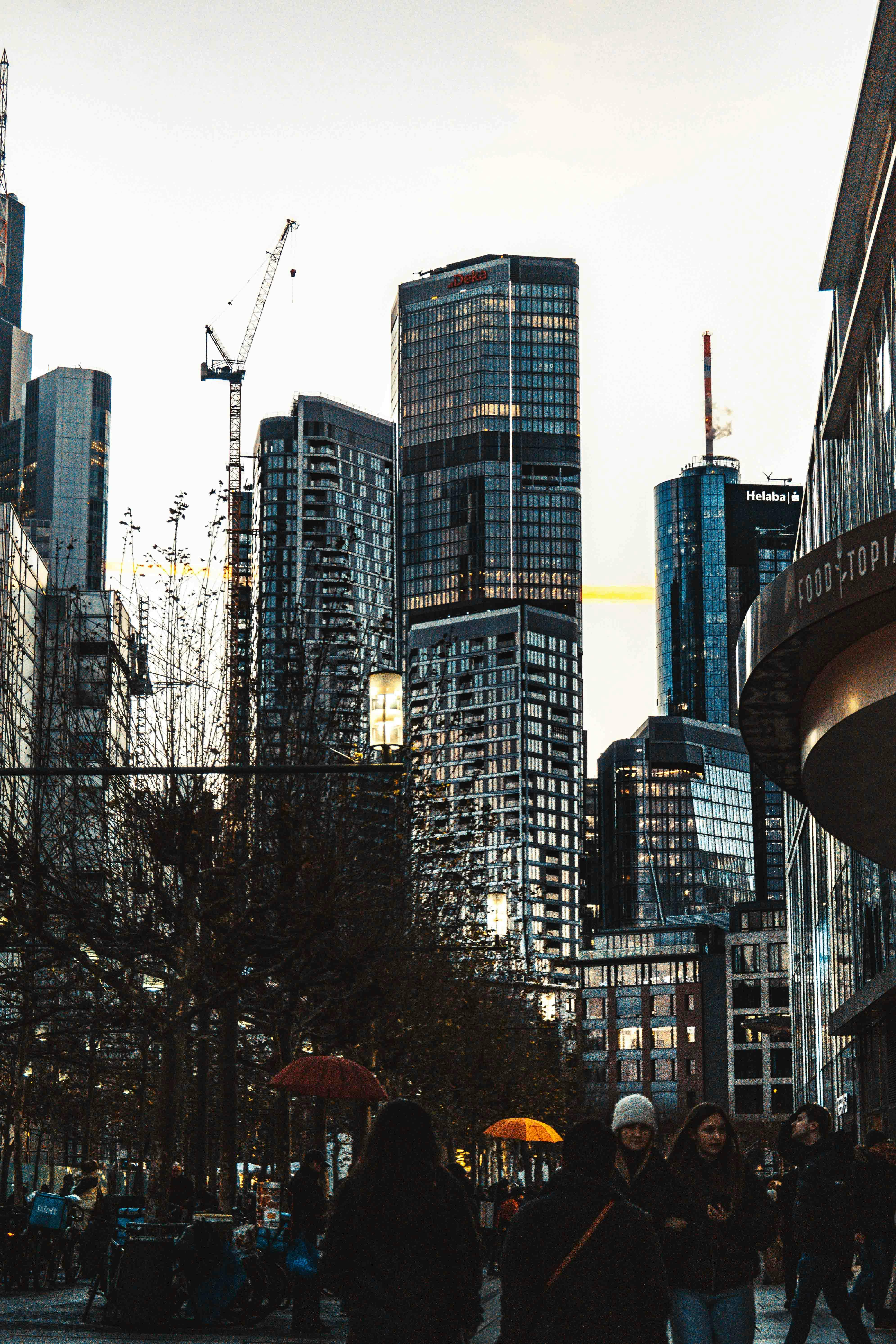 A person drawing a house blueprint on a tablet, representing real estate design