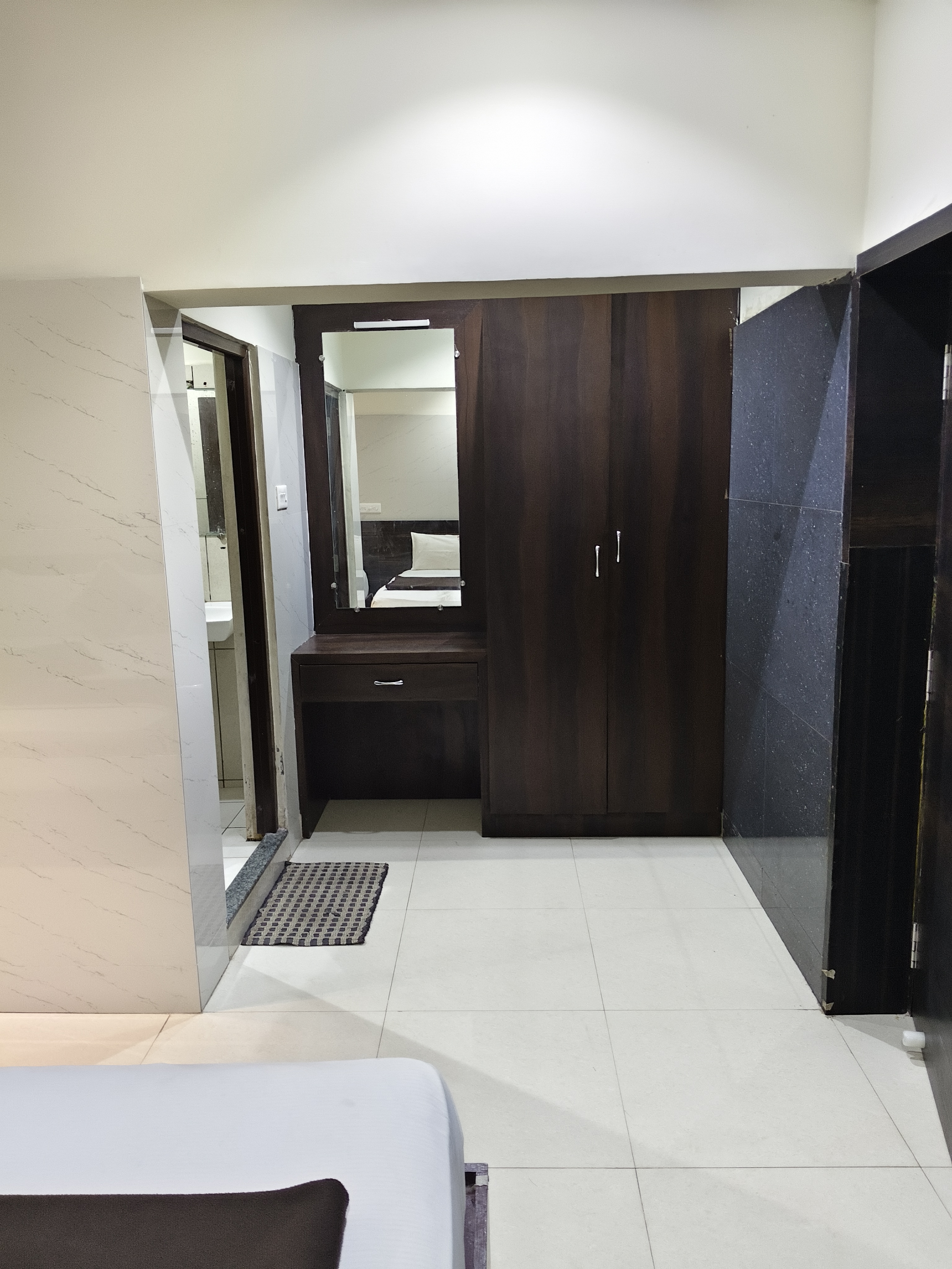 Spacious marble hallway and lounge area at Emirates Grand Inn