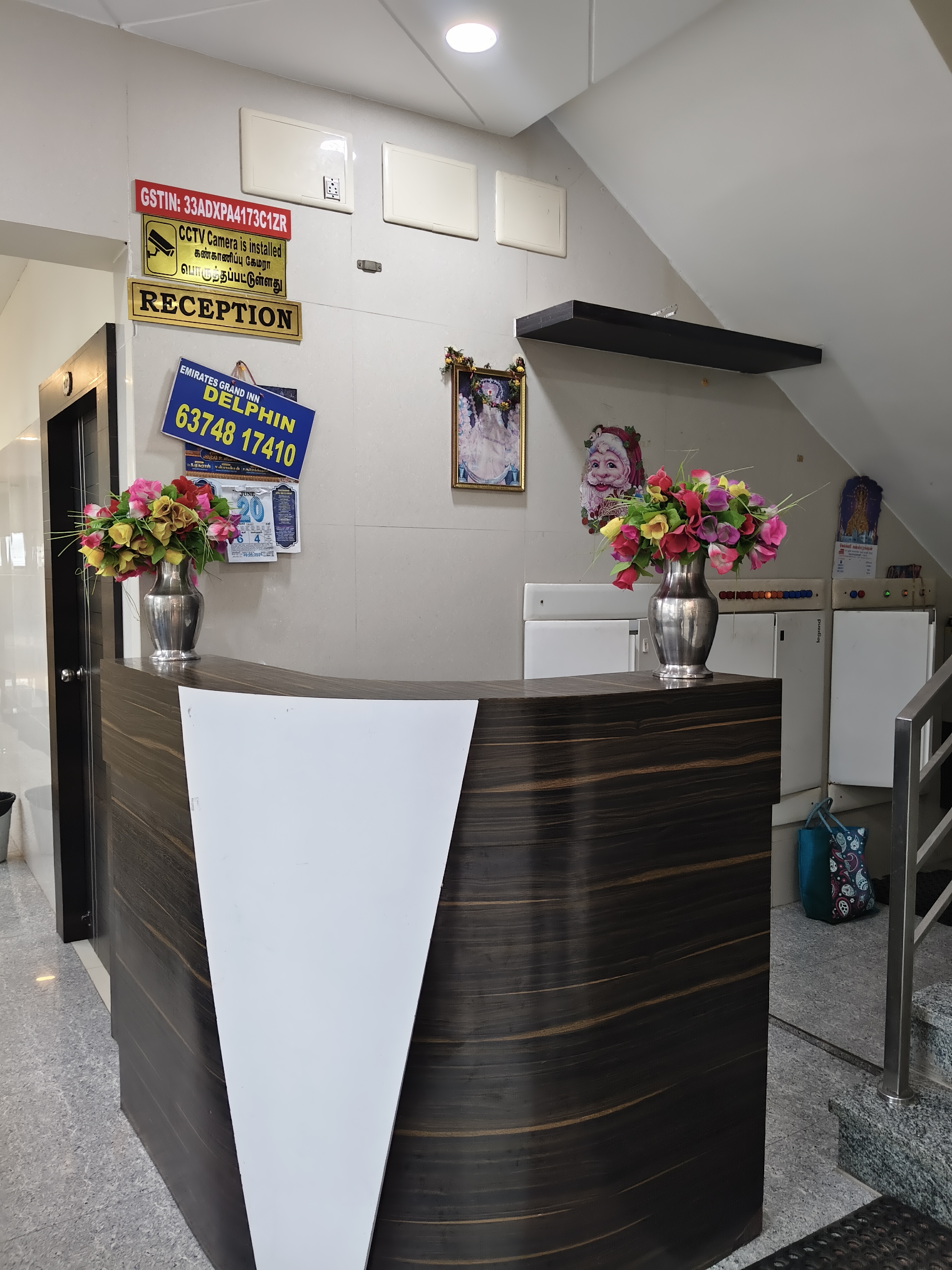 Luxurious double bedroom with seating area at Emirates Grand Inn