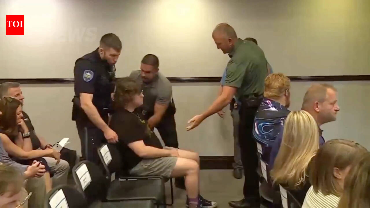 Kansas teacher dragged out in handcuffs after clapping at data center meeting