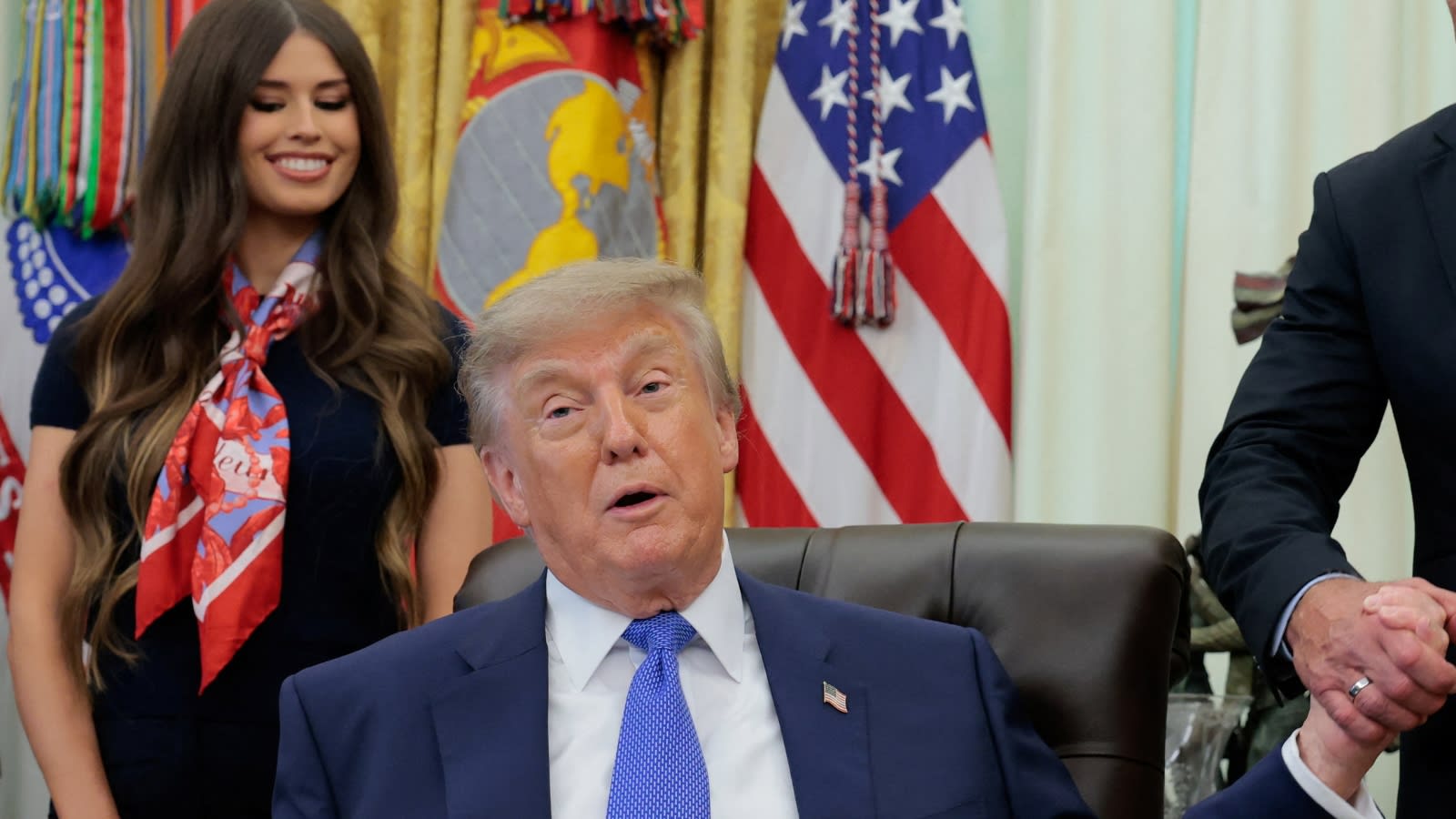 Trump ‘Zapper’ mystery: Why the woman behind him kept touching her stomach