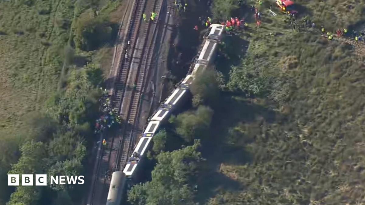 Aerial footage shows derailed train