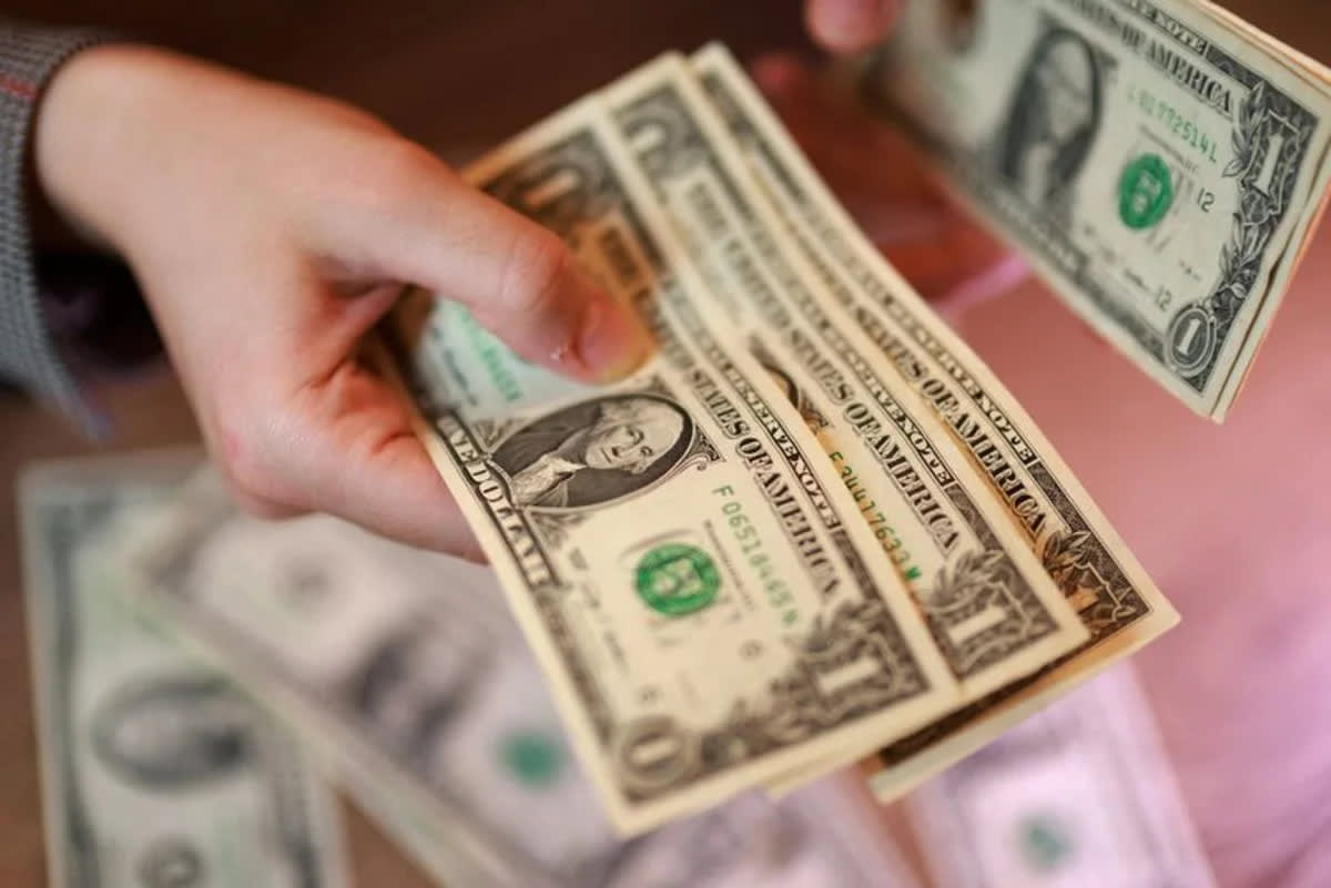 Dollar hits 3-month low vs euro, pares losses after Treasury move