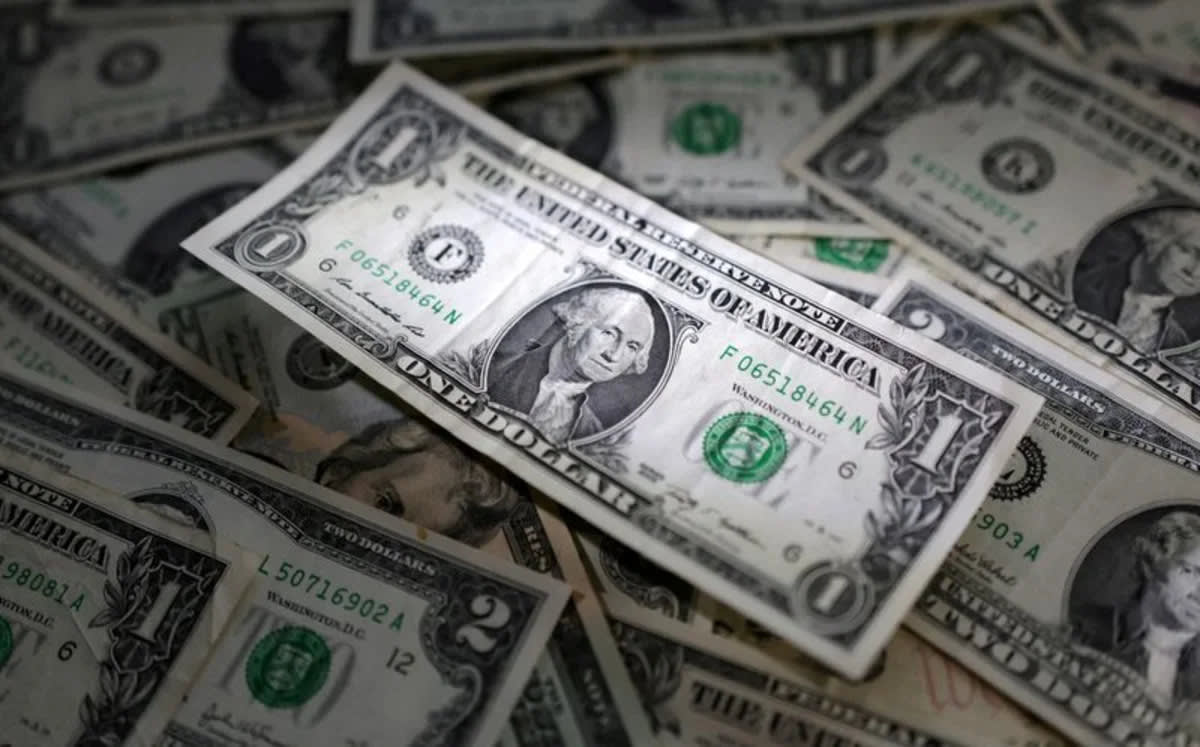 Dollar flat after data as focus shifts to Jackson Hole