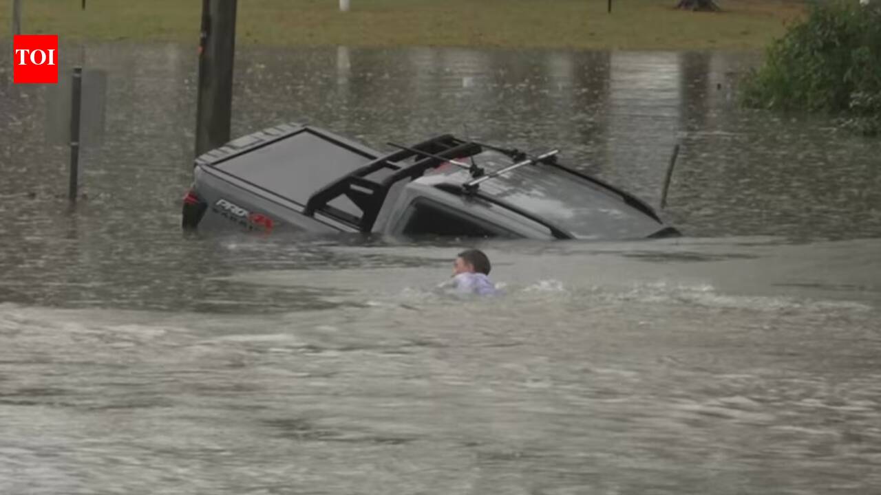 Australian reporter rescues driver moments before SUV sinks in floodwaters