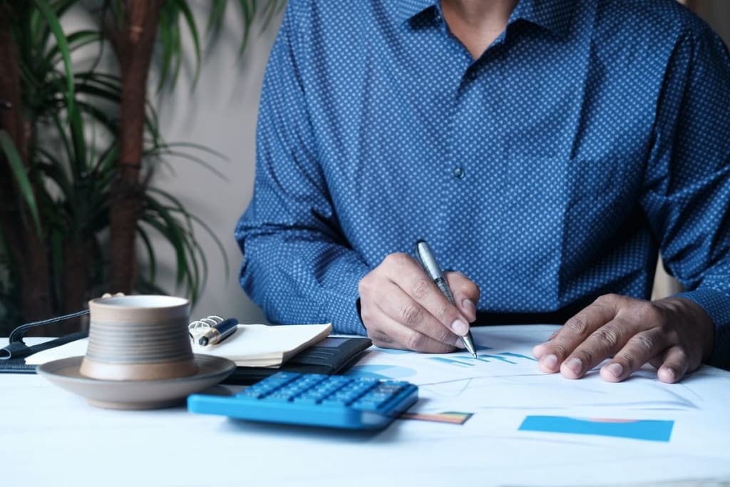 man with calculator