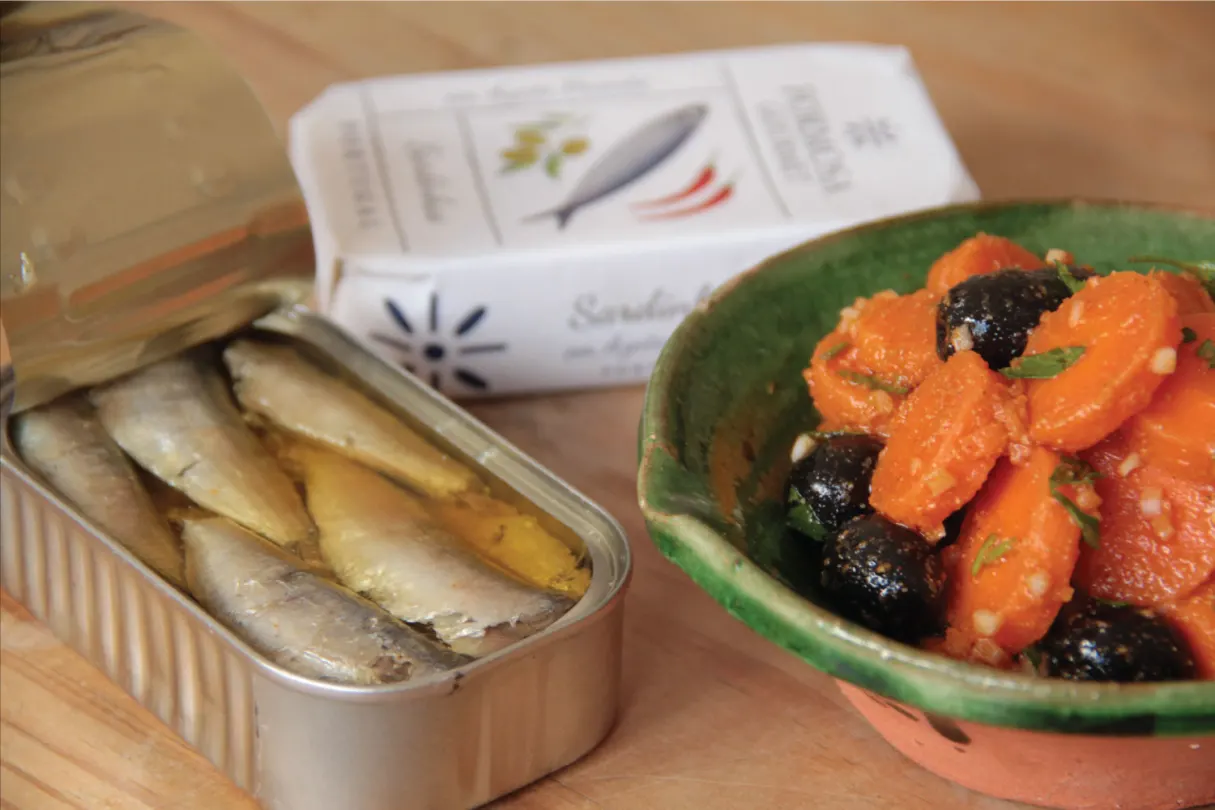 carrot salad next to sardines 