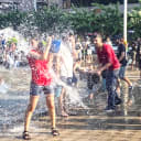 People splashing water during Vardavar festival at Republic Square in Yerevan, Armenia