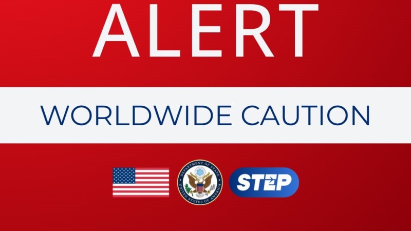 U.S. State Department graphic displaying a Worldwide Caution alert for U.S. citizens abroad, featuring a bell icon, American flag, State Department seal, and STEP program logo on a red background.