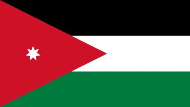 The national flag of Jordan, featuring horizontal black, white, and green stripes with a red chevron triangle on the hoist side containing a white seven-pointed star.