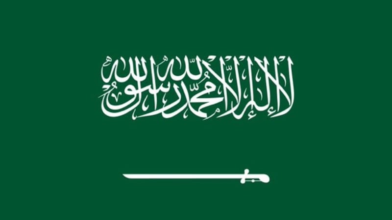 The national flag of Saudi Arabia, featuring white Arabic calligraphy of the Shahada and a horizontal sword on a green background.