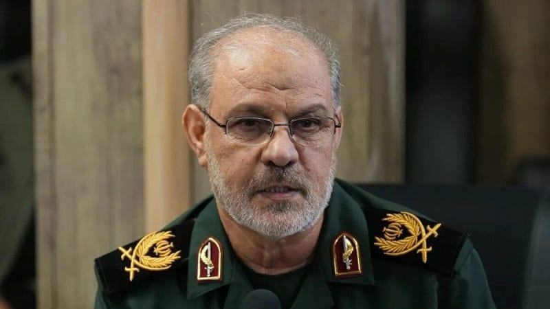 A senior Iranian military commander in an IRGC (Islamic Revolutionary Guard Corps) uniform with general-rank insignia speaking at a microphone, with an SNN news watermark visible in the bottom right corner.