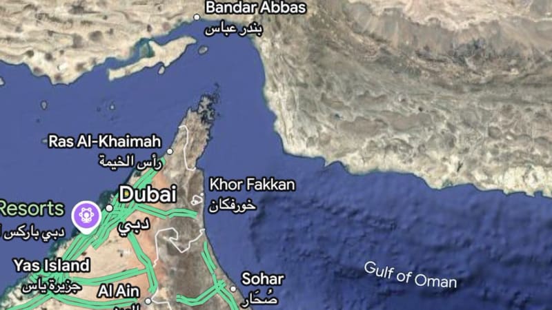 Satellite map view from Google Maps showing the Strait of Hormuz region, with a red pin marking Jiroft Airport in southeastern Iran. Visible labels include Bandar Abbas, Dubai, Ras Al-Khaimah, and the Gulf of Oman.