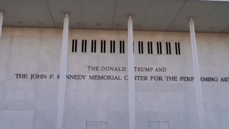 Exterior of the Kennedy Center for the Performing Arts in Washington, D.C., showing signage that has been modified to read 'The Donald Trump and The John F. Kennedy Memorial Center for the Performing Arts.'