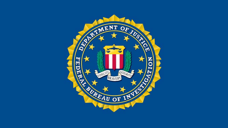 Official seal of the Federal Bureau of Investigation (FBI), Department of Justice, displayed on a dark blue background with the motto Fidelity, Bravery, Integrity.