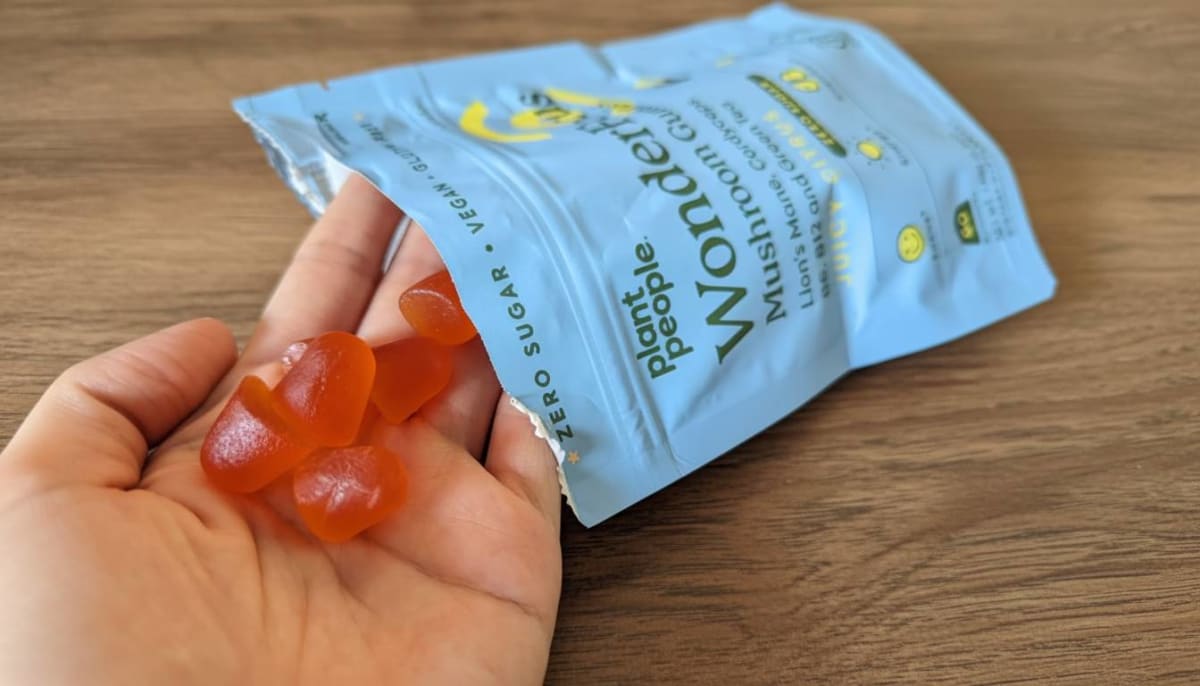 Plant People WonderFocus gummy pouch with juicy citrus flavor beside a laptop