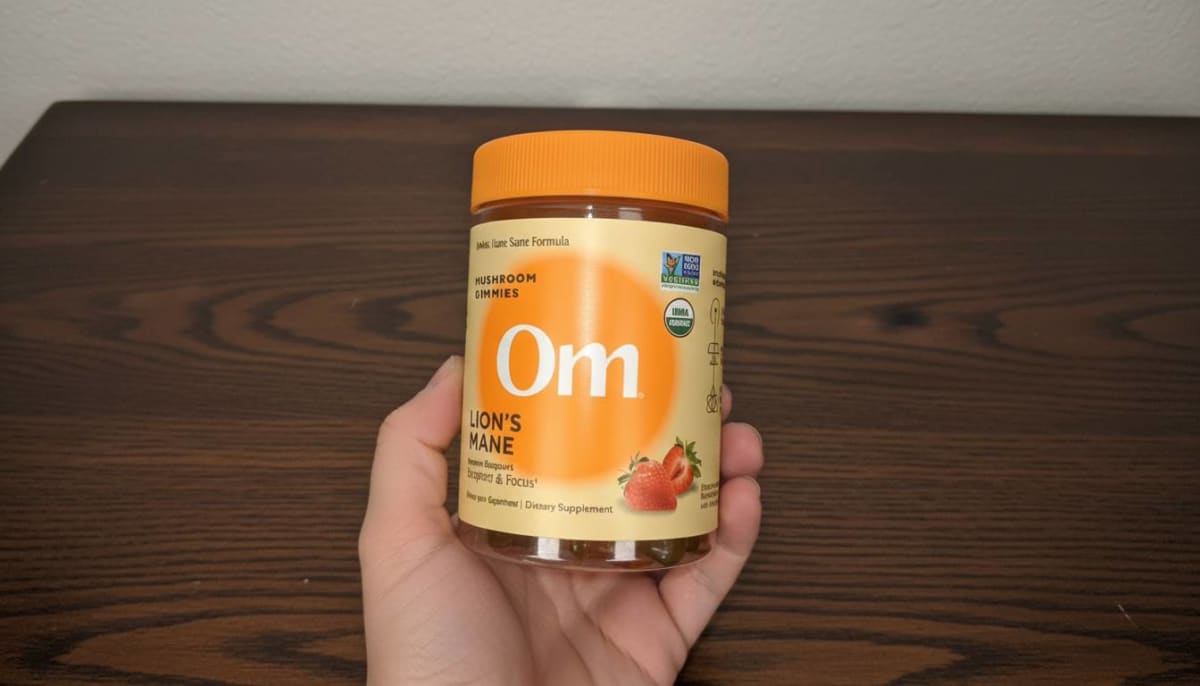 OM Mushroom Lion's Mane strawberry gummies jar on a white surface