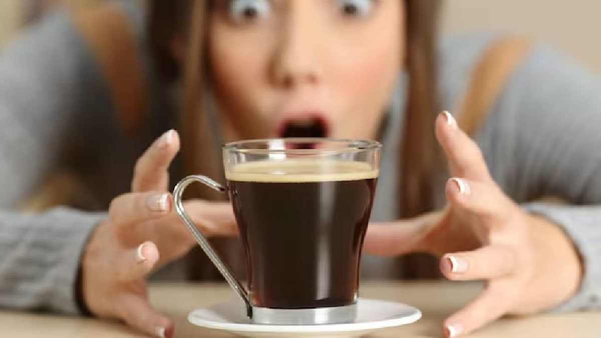 Cup of mushroom coffee on a table with mushroom extracts and powders