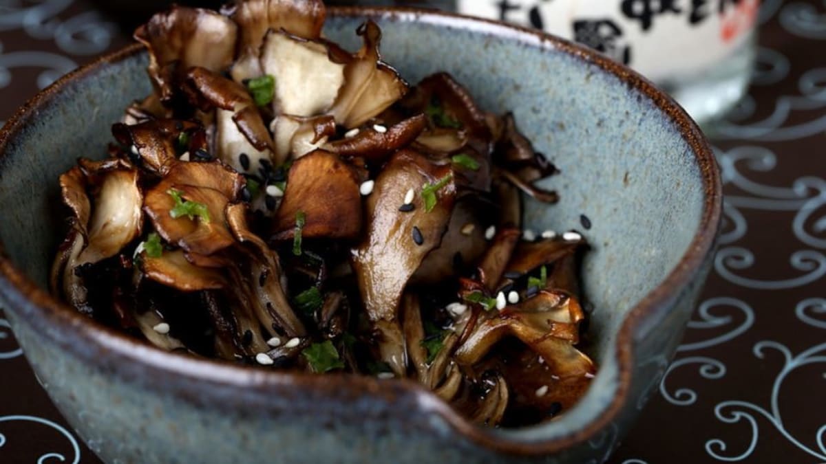 Sesame garlic maitake mushrooms seared in a cast iron skillet